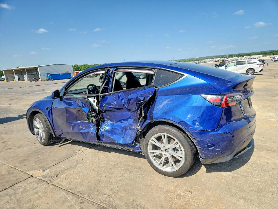 2023 Tesla Model y VIN 7SAYGDEEXPA064469 COPART salvage auction — SIDE, TX - SALVAGE VEHICLE TITLE (P), sold $5,900 on 2026-07-16 (photo 2)