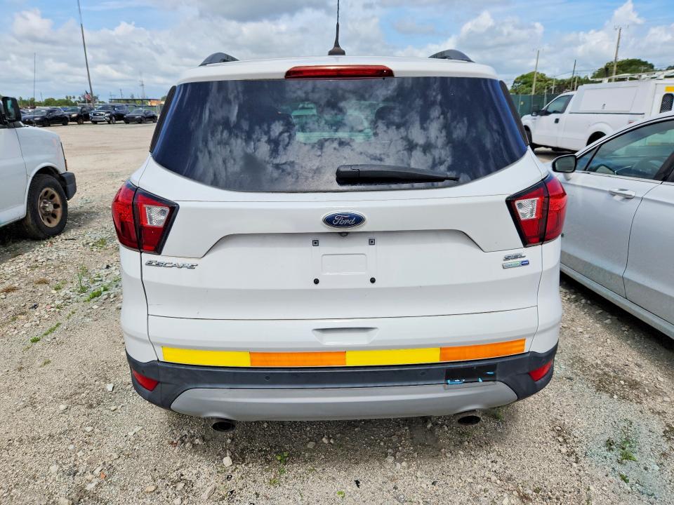 2019 Ford Escape VIN 1FMCU9HD0KUB14827 COPART salvage auction — MINOR DENT/SCRATCHES, Fl - Certificate Of Title, sold $2,050 on 2026-07-09 (photo 6)