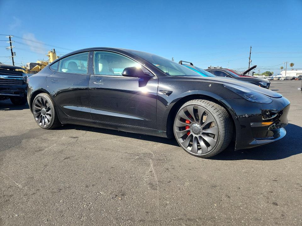 2021 Tesla VIN 5YJ3E1EC0MF000725 COPART salvage auction — FRONT END, CA - SALVAGE CERTIFICATE, sold $8,300 on 2026-08-03 (photo 4)