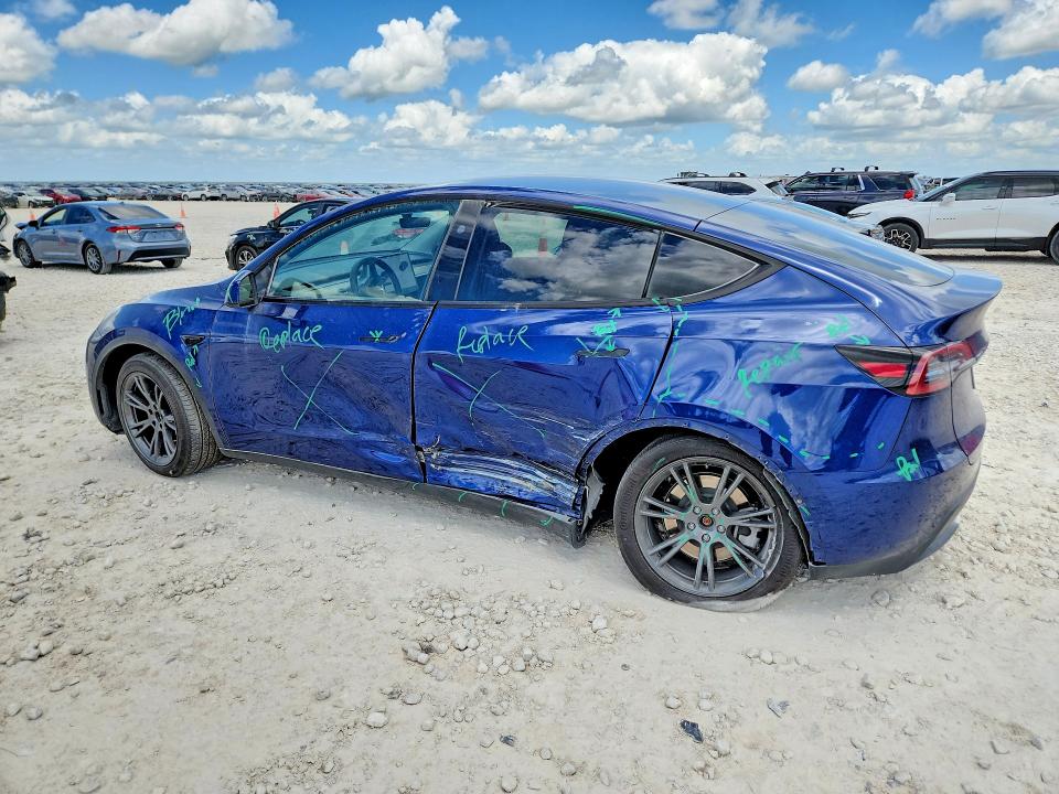 2024 Tesla Model y VIN 7SAYGAEEXRF115490 COPART salvage auction — SIDE, TX - SALVAGE VEHICLE TITLE (P), sold $13,700 on 2026-07-16 (photo 2)