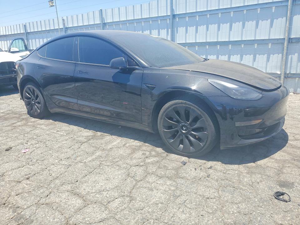 2023 Tesla Model 3 VIN 5YJ3E1EA4PF655229 COPART salvage auction — Burn Interior, Ca - Salvage Certificate, sold $7,000 on 2026-07-20 (photo 4)