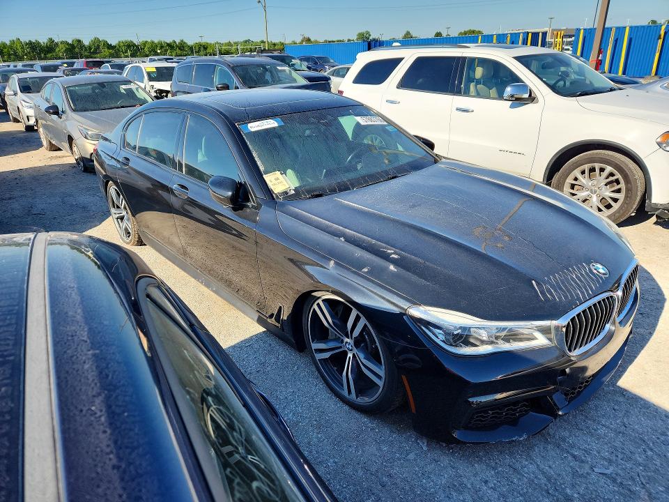 2018 BMW 7 series VIN WBA7F0C54JGM22962 COPART salvage auction — MINOR DENT/SCRATCHES, Wv - Certificate Of Title, sold $9,100 on 2026-07-27 (photo 4)