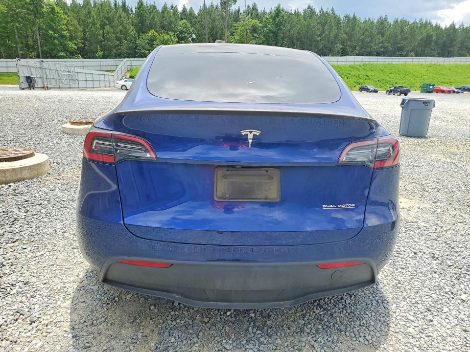 2024 Tesla Model y VIN 7SAYGDEF2RA265200 COPART salvage auction — SIDE, Nc - Salvage Certificate Of Title, sold $13,300 on 2026-07-23 (photo 6)