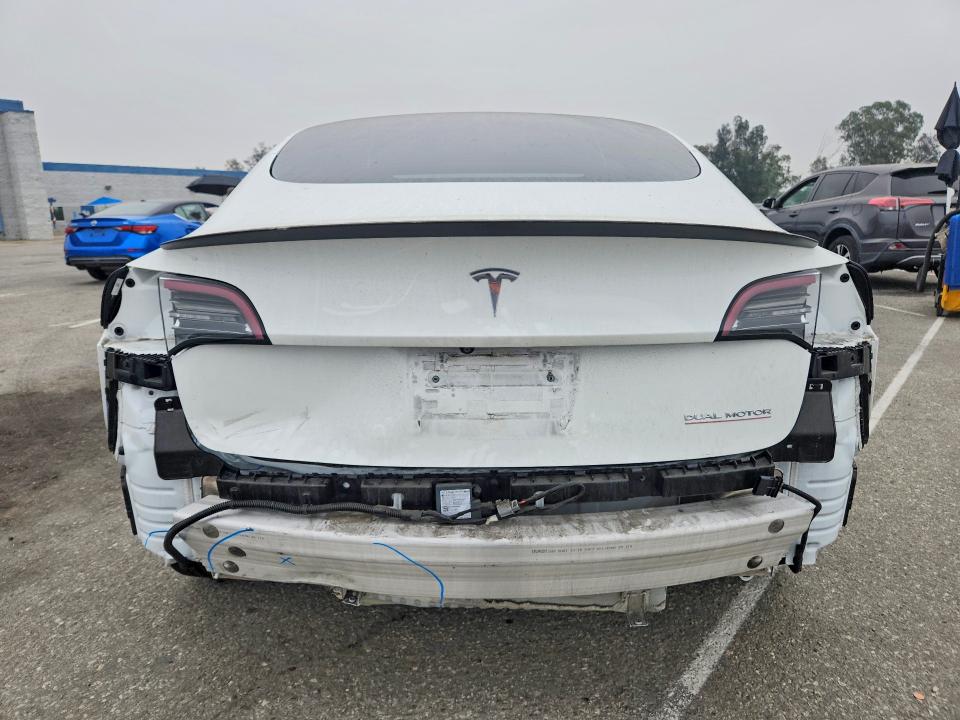 2021 Tesla Model 3 VIN 5YJ3E1EC9MF077884 COPART salvage auction — REAR END, CA - SALVAGE CERTIFICATE, sold $500 on 2026-07-21 (photo 6)