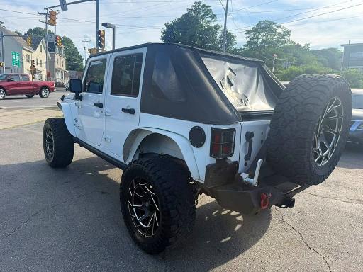 2014 Jeep Wrangler / VIN 1C4BJWDG7EL203909 COPART salvage auction — MINOR DENT/SCRATCHES, In - Certificate Of Title (P), sold $10,700 on 2026-07-29 (photo 2)