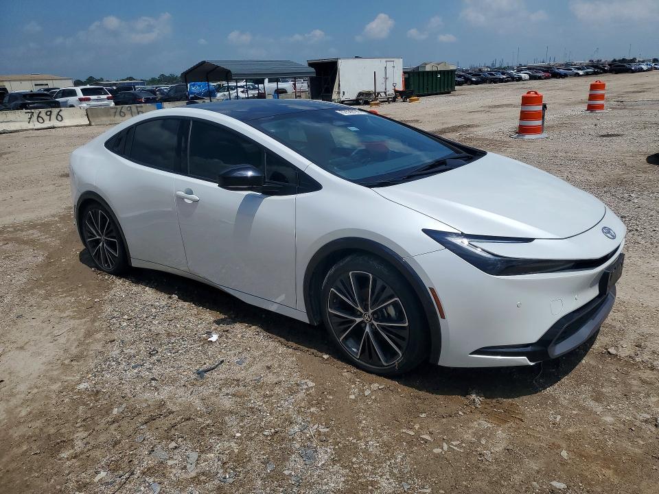 2023 Toyota Prius VIN JTDACAAU0P3011687 COPART salvage auction — SIDE, TX - SALVAGE VEHICLE TITLE (P), sold $7,000 on 2026-07-23 (photo 4)