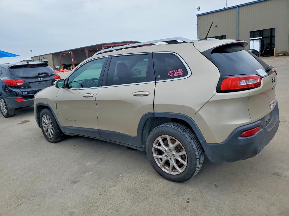 2014 Jeep Cherokee VIN 1C4PJLCS2EW297397 COPART salvage auction — SIDE, Tx - Certificate Of Title, sold $1,100 on 2026-07-09 (photo 2)