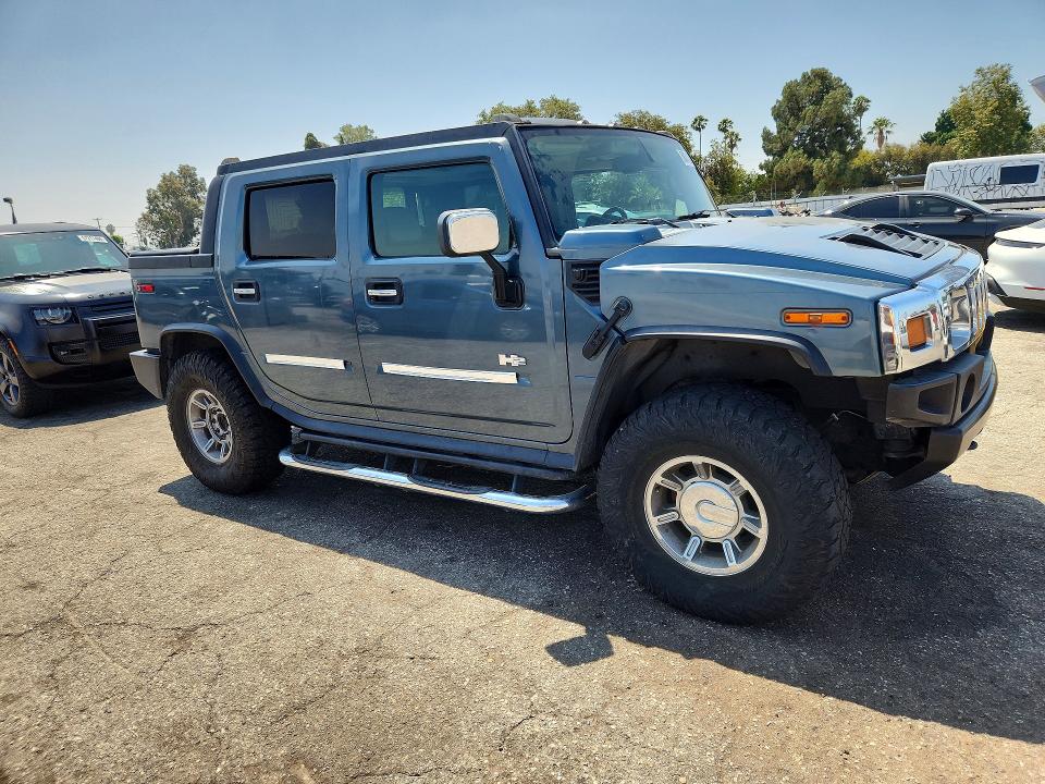 2005 Hummer H2 VIN 5GRGN22U95H115893 COPART salvage auction — SIDE, CA - LIEN PAPERS-SALVAGE OR AC, sold $5,000 on 2026-07-09 (photo 4)
