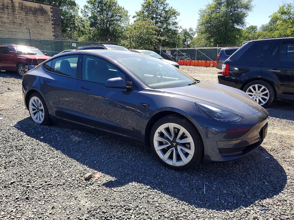 2023 Tesla Model 3 VIN 5YJ3E1EA6PF610258 COPART salvage auction — REAR END, Salvage Title, sold $5,400 on 2026-07-09 (photo 4)