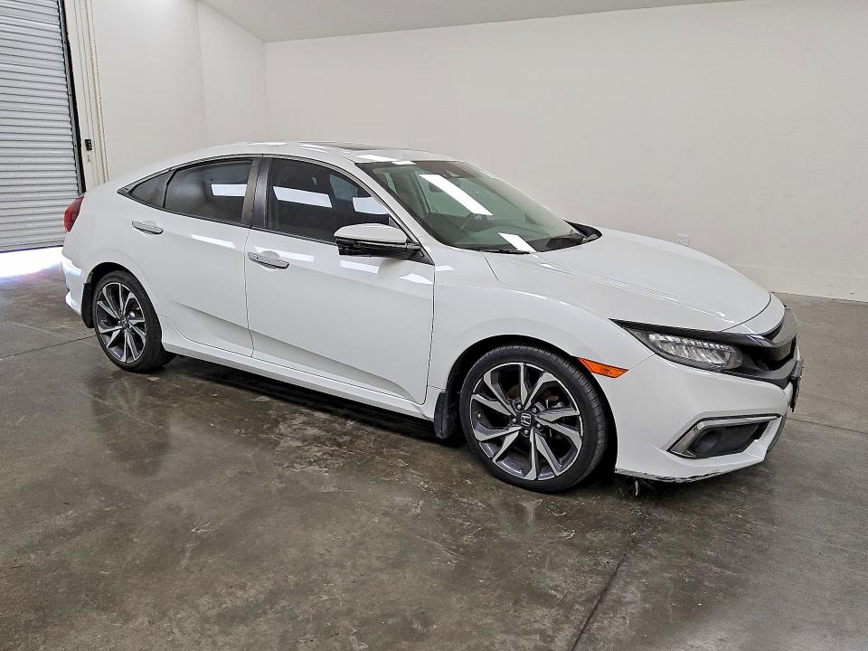 2020 Honda Civic VIN 19XFC1F96LE020729 COPART salvage auction — MINOR DENT/SCRATCHES, Tx - Certificate Of Title, sold $15,000 on 2026-07-09 (photo 4)