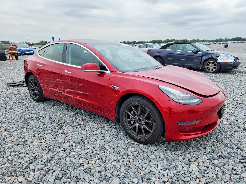 2019 Tesla Model 3 VIN 5YJ3E1EA9KF308357 COPART salvage auction — SIDE, Fl - Cert Of Title Slvg Rebuildable, sold $6,600 on 2026-07-07 (photo 4)
