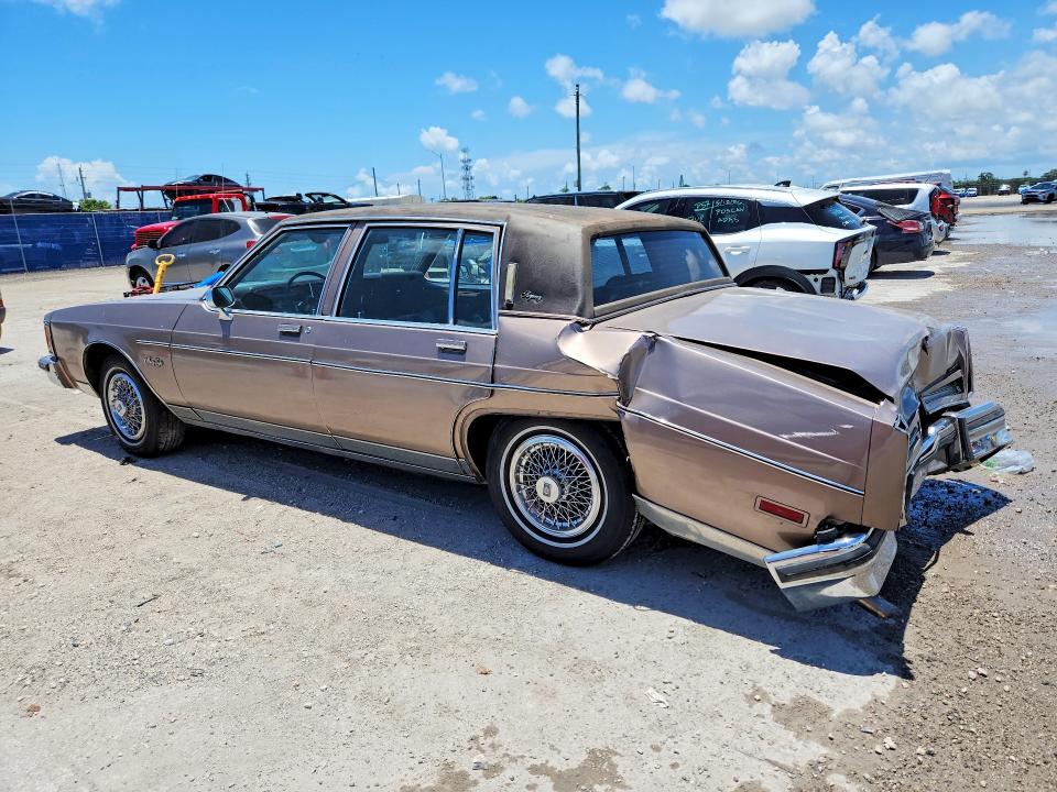 1984 Oldsmobile 98 VIN 1G3AG69Y6EM871948 COPART salvage auction — REAR END, Fl - Cert Of Ttl-Rebuilt&Slvg Rbld, sold $275 on 2026-07-29 (photo 2)