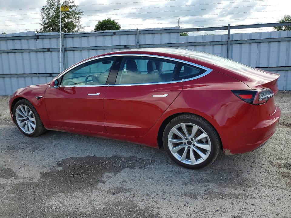 2018 Tesla Model 3 VIN 5YJ3E1EB1JF126997 COPART salvage auction — MINOR DENT/SCRATCHES, On - Permit Rebuilt - Unfit, sold $7,400 on 2026-07-03 (photo 2)