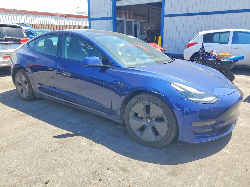 2023 Tesla Model 3 VIN 5YJ3E1EA9PF677632 COPART salvage auction — SIDE, Nv - Salvage Title, sold $8,200 on 2026-07-15 (photo 4)