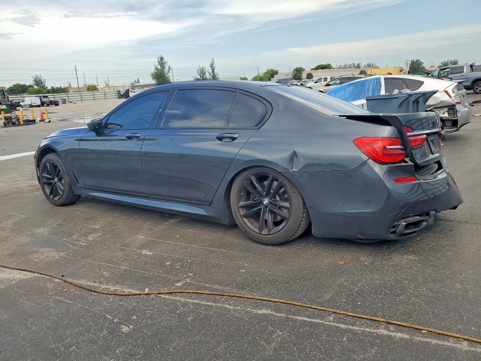 2016 BMW 7er VIN WBA7F2C52GG418655 COPART salvage auction — SIDE, Fl - Cert Of Title Slvg Rebuildable, sold $5,000 on 2026-07-08 (photo 2)