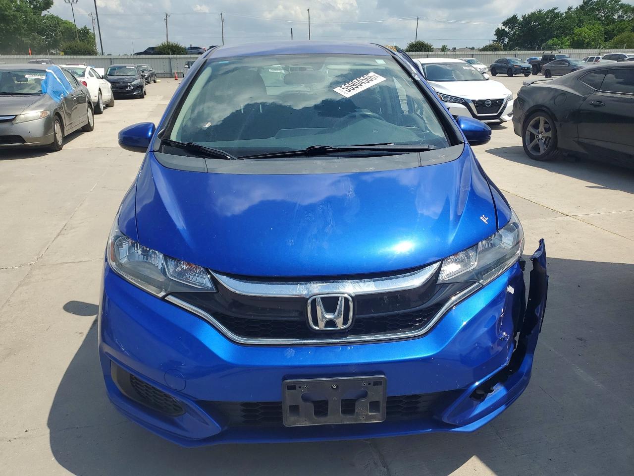 2019 Honda Fit VIN 3HGGK5H4XKM700090 COPART salvage auction — Side, TX - SALVAGE VEHICLE TITLE, sold $2,250 on 2026-07-09 (photo 5)