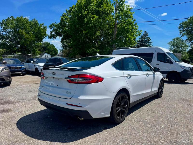 2020 Ford Fusion VIN 3FA6P0CDXLR117972 COPART salvage auction — NORMAL WEAR, IN - CERTIFICATE OF TITLE (P), sold $4,450 on 2026-07-10 (photo 4)