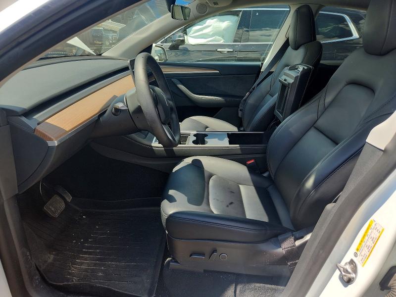 2023 Tesla Model y VIN 7SAYGDEEXPF671829 COPART salvage auction — REAR END, MI - CERTIFICATE OF TITLE, sold $15,600 on 2026-07-10 (photo 7)