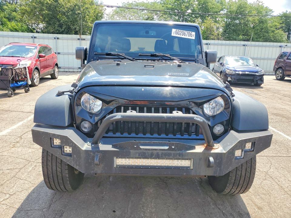 2014 Jeep Wrangler / VIN 1C4BJWDG9EL329091 COPART salvage auction — MINOR DENT/SCRATCHES, Oh - Certificate Of Title (P), sold $1,100 on 2026-09-09 (photo 5)