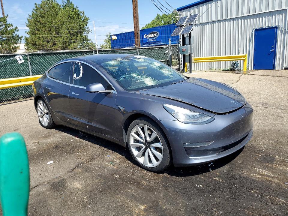 2020 Tesla Model 3 VIN 5YJ3E1EB0LF638057 COPART salvage auction — HAIL, Co - Certificate Of Title, sold $10,100 on 2026-09-01 (photo 4)
