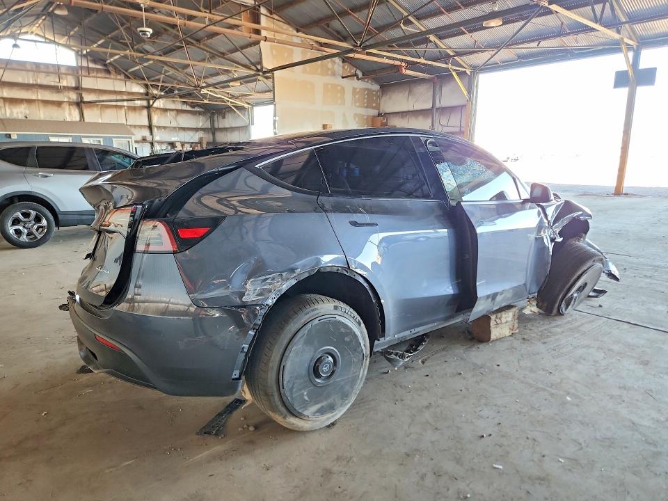 2023 Tesla Model y VIN 7SAYGDEE9PF709423 COPART salvage auction — ALL OVER, AZ - CERT OF TITLE- NON REPAIR, sold $3,050 on 2026-07-27 (photo 3)