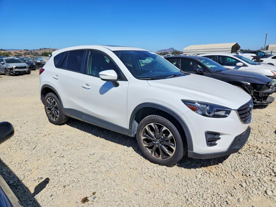 2016 Mazda Cx-5 VIN JM3KE2DY8G0872224 COPART salvage auction — SIDE, Ca - Salvage Certificate, sold $825 on 2026-07-23 (photo 4)