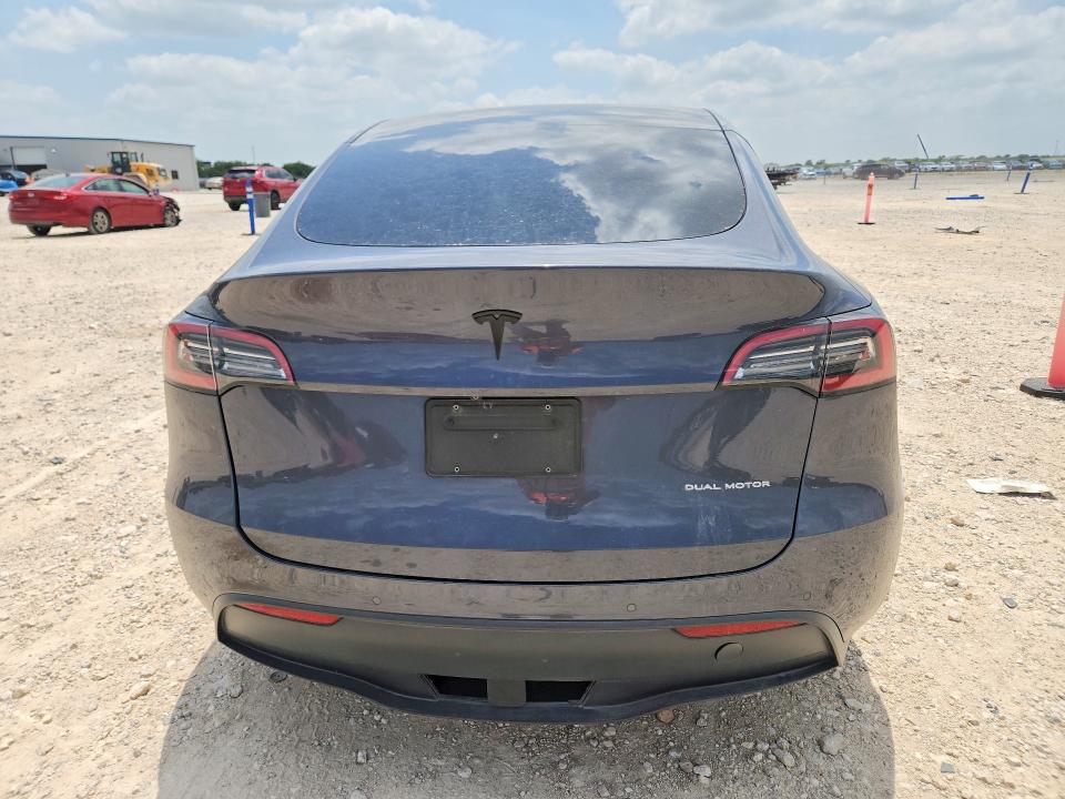 2021 Tesla Model y VIN 5YJYGDEE9MF149038 COPART salvage auction — NORMAL WEAR, TX - CERT OF TITLE-REBUILT SALVAGE, sold $9,900 on 2026-08-03 (photo 6)