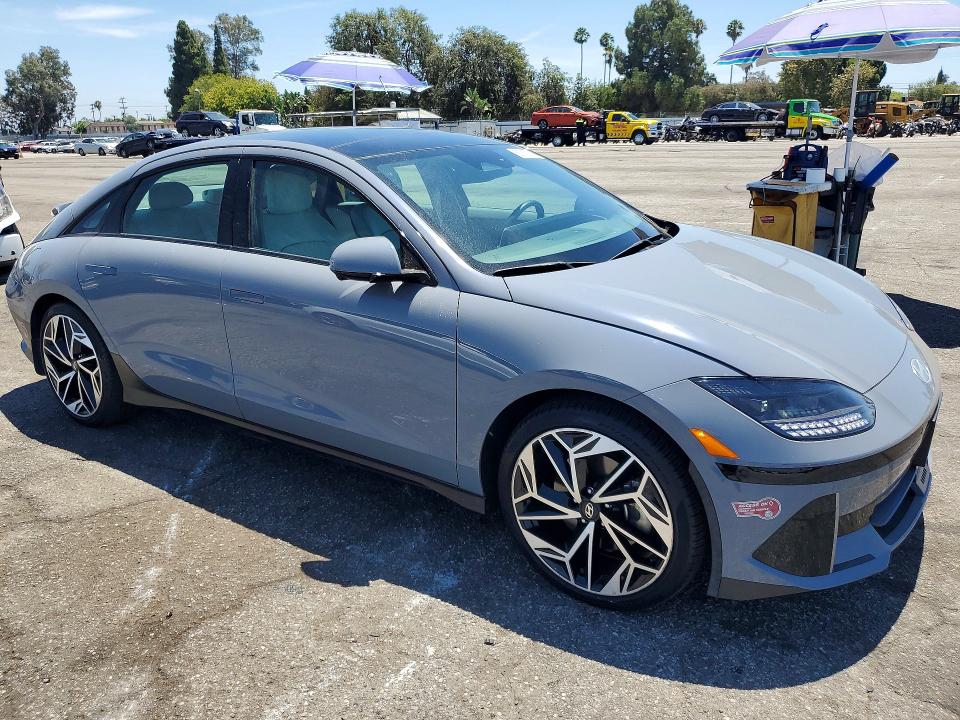 2023 Hyundai Ioniq 6 VIN KMHM54AA8PA045768 COPART salvage auction — DAMAGE HISTORY, CA - CERT OF TITLE-SALVAGED, sold $13,700 on 2026-07-31 (photo 4)