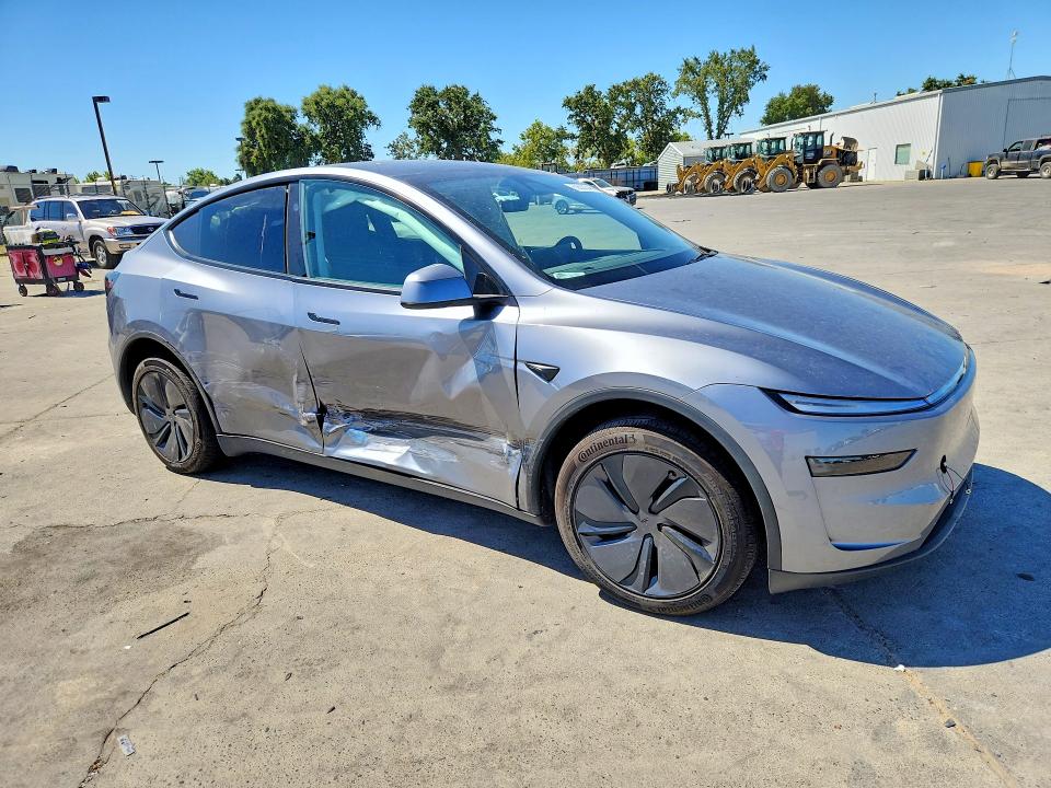 2026 Tesla Model y VIN 7SAYGDED9TF521728 COPART salvage auction — SIDE, Ca - Salvage Certificate, sold $17,900 on 2026-08-31 (photo 4)