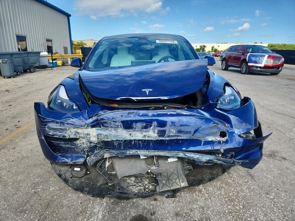2023 Tesla VIN 5YJ3E1EA4PF412388 COPART salvage auction — FRONT END, Fl - Cert Of Title Slvg Rebuildable, sold $5,400 on 2026-09-10 (photo 5)