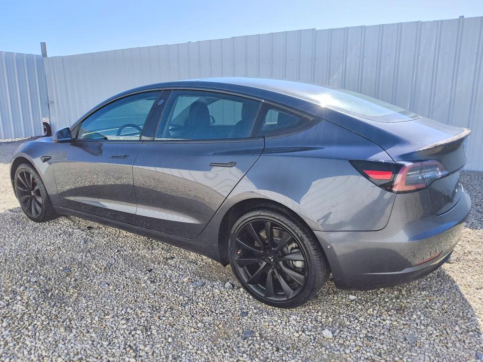 2018 Tesla Model 3 VIN 5YJ3E1EB7JF185035 COPART salvage auction — NORMAL WEAR, Fl - Certificate Of Title, sold $10,900 on 2026-07-28 (photo 2)