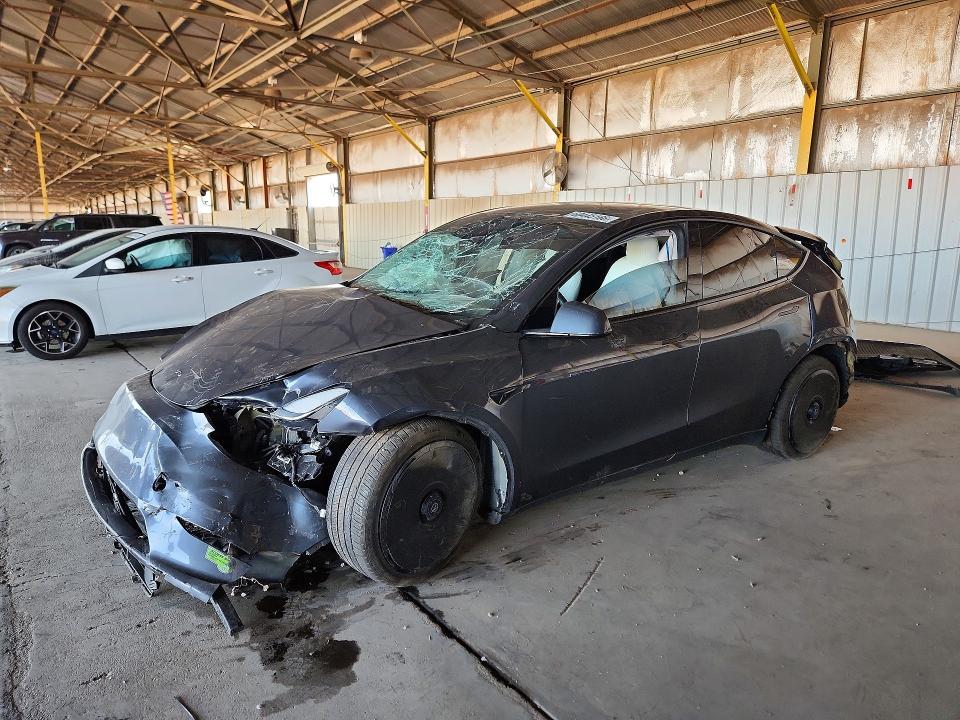 2023 Tesla Model y VIN 7SAYGDEE9PF709423 COPART salvage auction — ALL OVER, AZ - CERT OF TITLE- NON REPAIR, sold $3,050 on 2026-07-27 (photo 1)