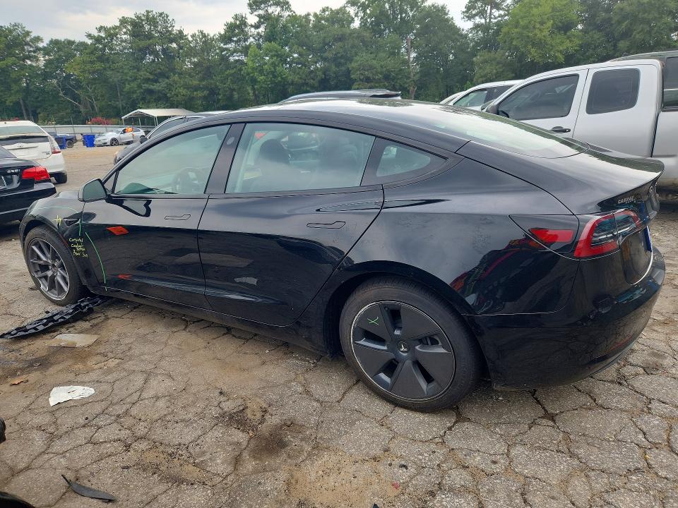 2023 Tesla Model 3 VIN 5YJ3E1EA9PF668011 COPART salvage auction — SIDE, Ga - Certificate Of Title, sold $14,600 on 2026-07-31 (photo 2)