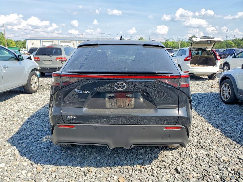 2025 Toyota Bz4x VIN JTMAAAAA6SA073563 COPART salvage auction — SIDE, MA - CERT OF TITLE-SALVAGE (P), sold $8,000 on 2026-08-19 (photo 6)