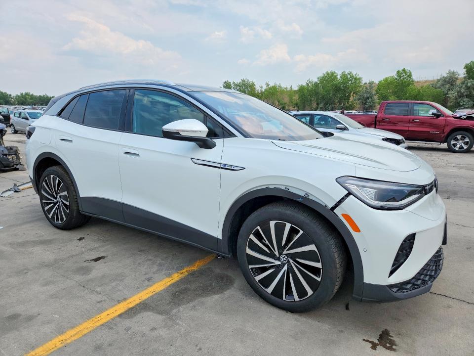 2023 Volkswagen Id.4 VIN 1V2JNPE8XPC043247 COPART salvage auction — SIDE, Co - Salvage Title, sold $11,200 on 2026-08-31 (photo 4)