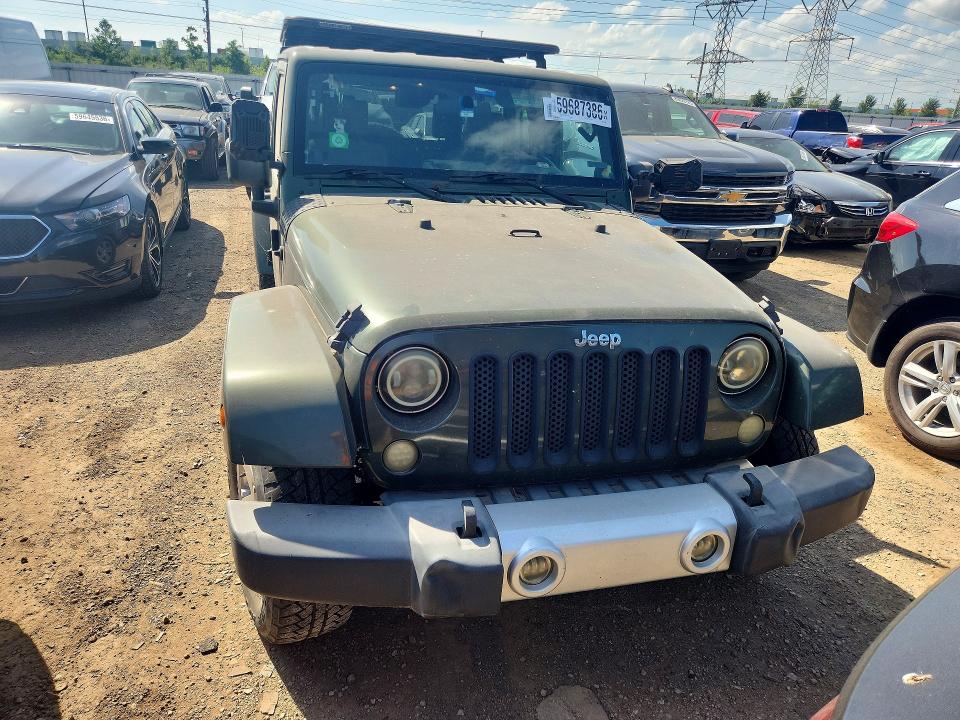 2008 Jeep Wrangler unlimited VIN 1J4GA59198L520500 COPART salvage auction — NORMAL WEAR, IN - CERTIFICATE OF TITLE, sold $2,472 on 2026-07-09 (photo 5)
