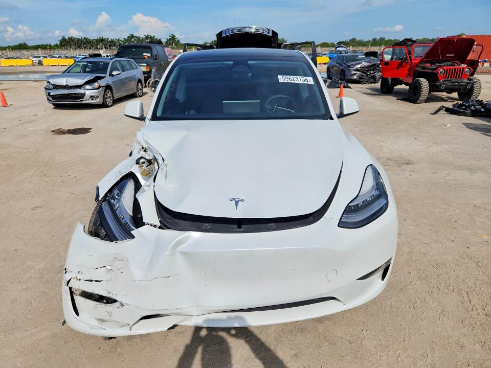 2023 Tesla Model y VIN 7SAYGDEE5PA092096 COPART salvage auction — FRONT END, Fl - Cert Of Title Slvg Rebuildable, sold $13,600 on 2026-07-15 (photo 5)