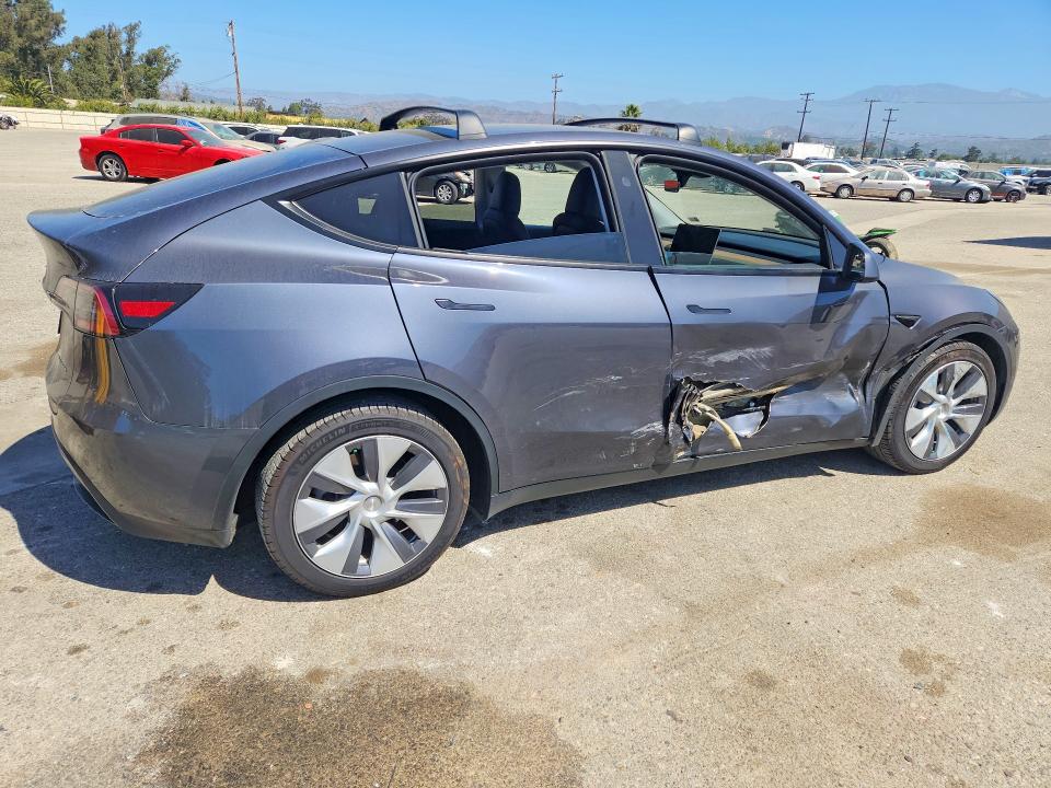 2023 Tesla Model y VIN 7SAYGDEEXPF928052 COPART salvage auction — SIDE, Salvage Title, sold $14,500 on 2026-07-28 (photo 3)
