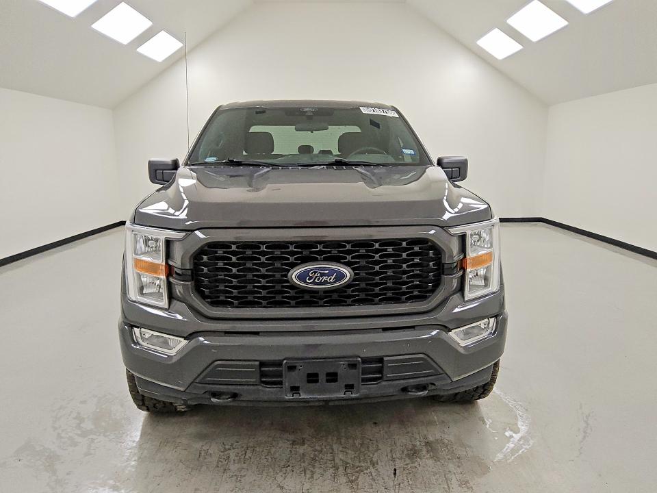 2021 Ford F-150 lightning VIN 1FTFW1E52MKD65101 COPART salvage auction — MINOR DENT/SCRATCHES, TX - CERTIFICATE OF TITLE, sold $14,600 on 2026-07-23 (photo 5)
