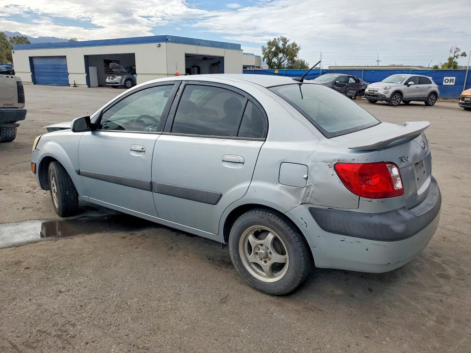 2009 Kia Rio VIN KNADE223X96451207 COPART salvage auction — FRONT END, TX - SALVAGE VEHICLE TITLE (P), sold $125 on 2026-07-31 (photo 2)