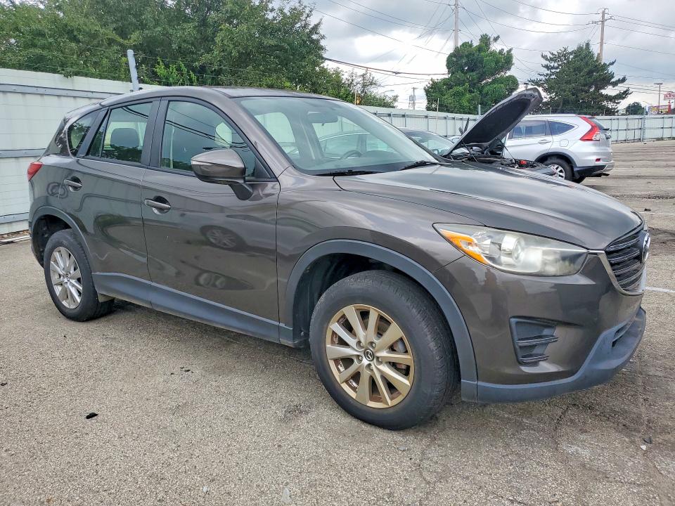 2016 Mazda VIN JM3KE4BY9G0770705 COPART salvage auction — MINOR DENT/SCRATCHES, Oh - Certificate Of Title, sold $1,800 on 2026-07-22 (photo 4)