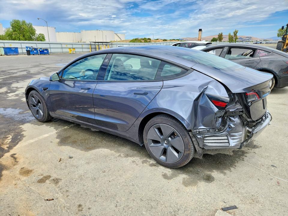 2023 Tesla Model 3 VIN 5YJ3E1EA4PF687985 COPART salvage auction — REAR END, CA - CERTIFICATE OF TITLE (P), sold $17,000 on 2026-07-27 (photo 2)