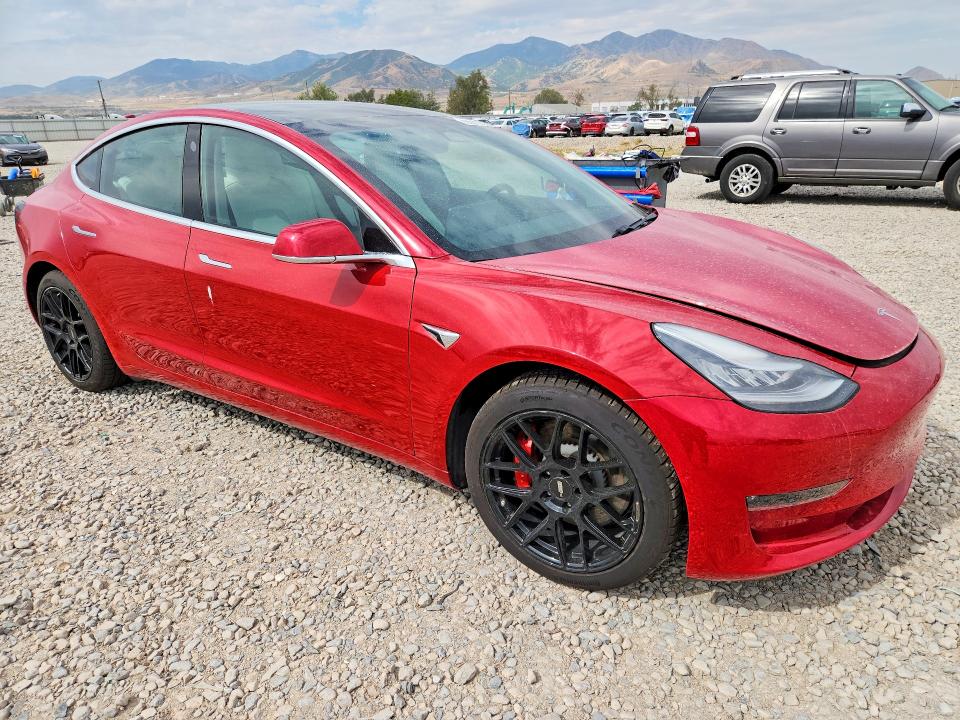 2020 Tesla Model 3 VIN 5YJ3E1EC7LF714737 COPART salvage auction — MINOR DENT/SCRATCHES, Salvage Title, sold $7,200 on 2026-09-04 (photo 4)
