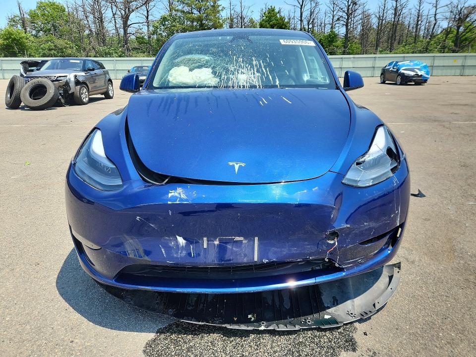 2023 Tesla Model y VIN 7SAYGDEE2PF887397 COPART salvage auction — FRONT END, NY - MV-907A SALVAGE CERTIFICATE, sold $11,500 on 2026-07-27 (photo 5)