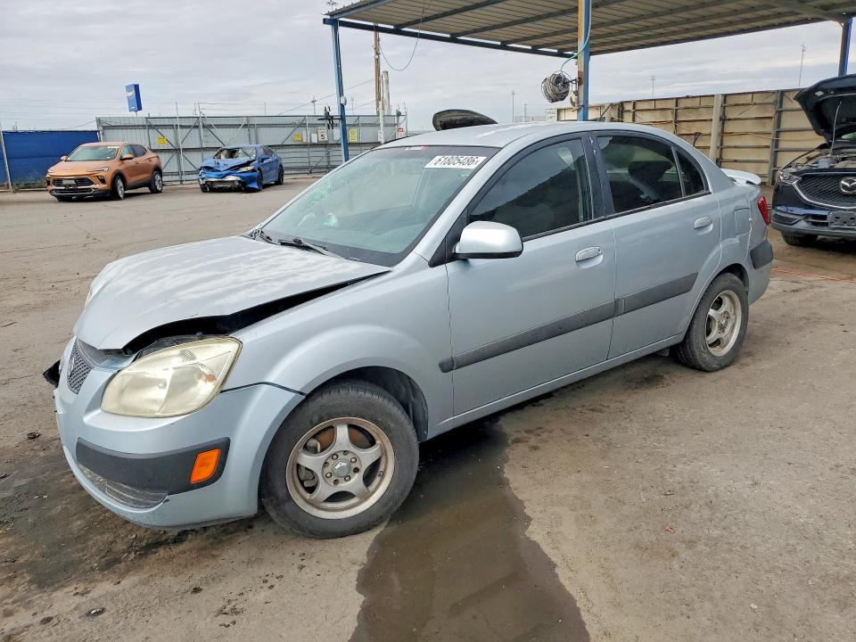 2009 Kia Rio VIN KNADE223X96451207 COPART salvage auction — FRONT END, TX - SALVAGE VEHICLE TITLE (P), sold $125 on 2026-07-31 (photo 1)
