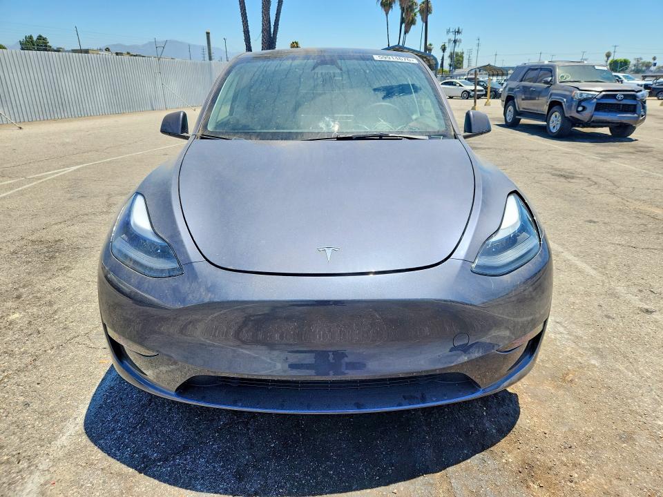 2023 Tesla Model y VIN 7SAYGDEE8PF918877 COPART salvage auction — REAR END, CA - SALVAGE CERTIFICATE, sold $15,700 on 2026-07-24 (photo 5)
