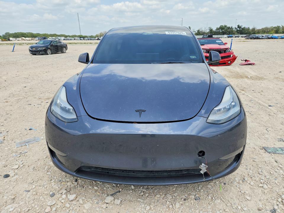 2021 Tesla Model y VIN 5YJYGDEE9MF149038 COPART salvage auction — NORMAL WEAR, TX - CERT OF TITLE-REBUILT SALVAGE, sold $9,900 on 2026-08-03 (photo 5)