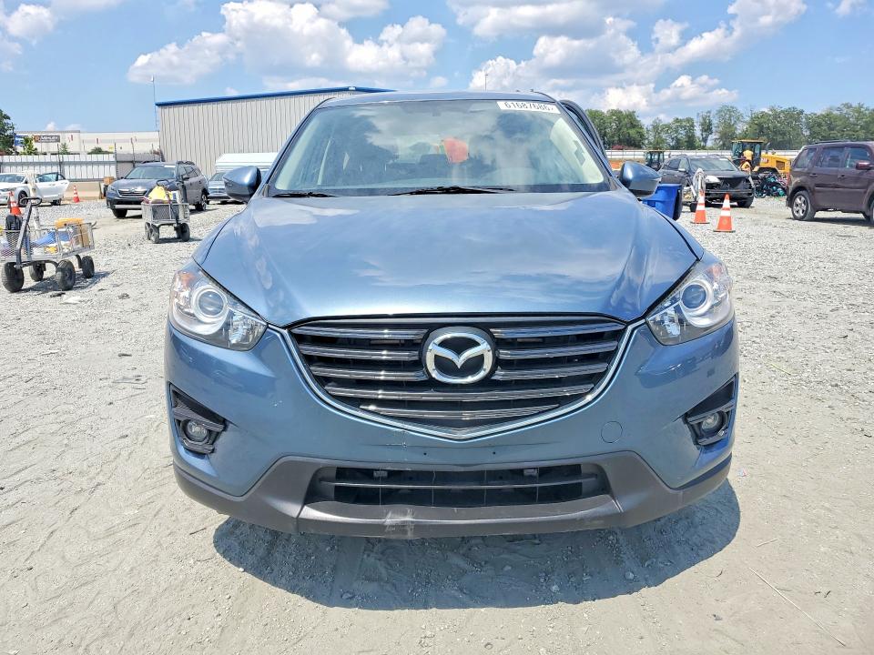 2016 Mazda Cx-5 VIN JM3KE4CY4G0763644 COPART salvage auction — SIDE, Sc - Certificate Of Title, sold $2,250 on 2026-07-29 (photo 5)