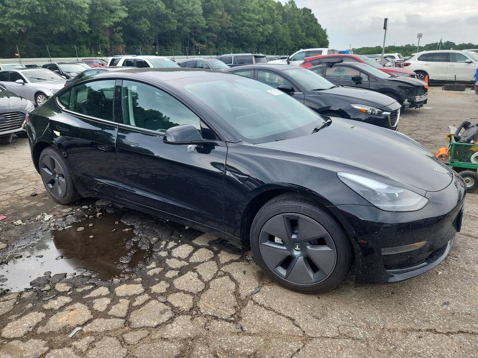 2023 Tesla Model 3 VIN 5YJ3E1EA9PF668011 COPART salvage auction — SIDE, Ga - Certificate Of Title, sold $14,600 on 2026-07-31 (photo 4)