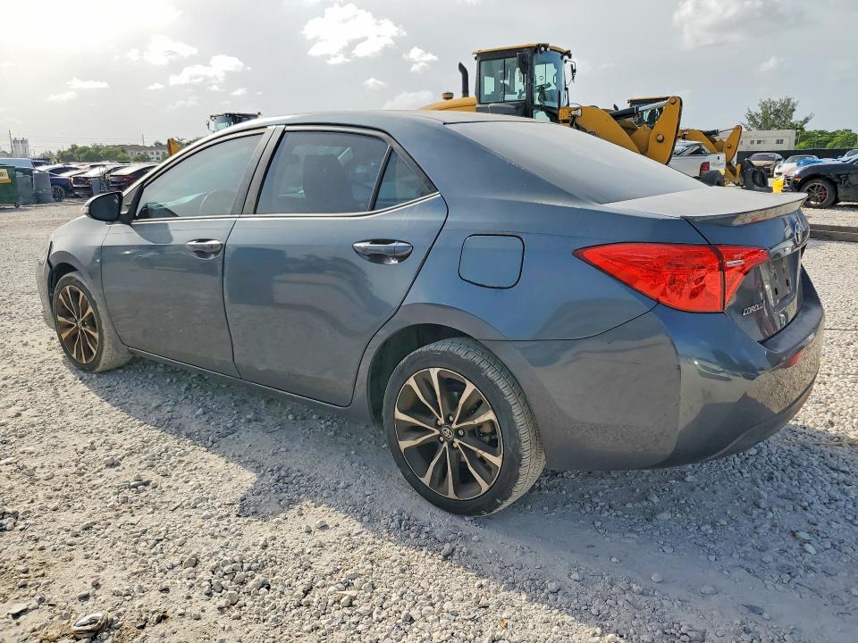 2017 Toyota Corolla VIN 5YFBURHE8HP616757 COPART salvage auction — SIDE, Fl - Cert Of Title Slvg Rebuildable, sold $2,100 on 2026-07-28 (photo 2)